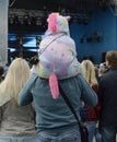 A girl in a carnival costume on her fatherÃÆÃÂ¢ÃÂ¢Ã¢â¬Å¡ÃÂ¬ÃÂ¢Ã¢â¬Å¾ÃÂ¢s shoulders is watching a concert.